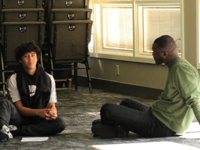 A student and a mentor talking one on one