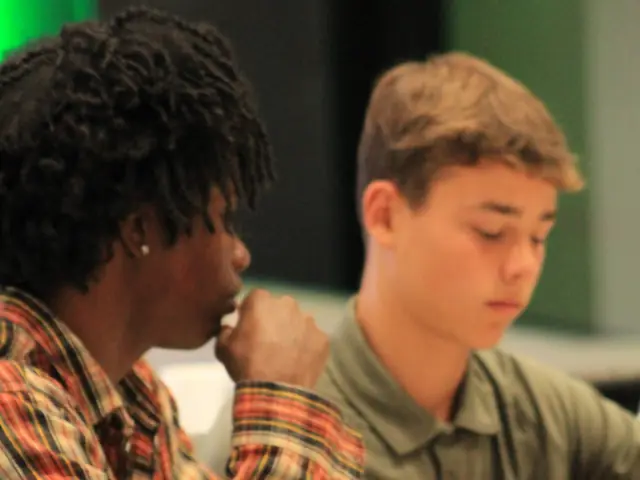 Two students working at their table